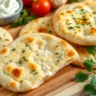 Golden brown cottage cheese flatbread with a soft, fluffy texture, garnished with fresh herbs, perfect gluten-free and low-carb flatbread option