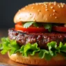 Juicy Wagyu burger with fresh lettuce, tomato, and aioli on a brioche bun