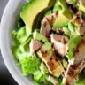 Avocado Chicken Salad with Chipotle and Lime in a white dish, captured with soft natural lighting