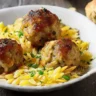 Greek Chicken Meatballs with Lemon Orzo served in a white dish with fresh herbs and feta, captured with soft natural light