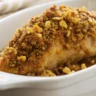 Close-up, overhead view of Crunchy Maple Dijon Chicken showing its crispy texture and golden glaze, captured in soft natural light.